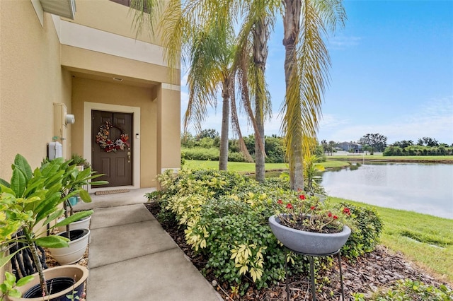 doorway to property featuring a water view