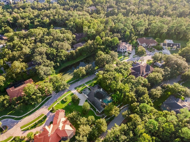 bird's eye view featuring a residential view and a forest view
