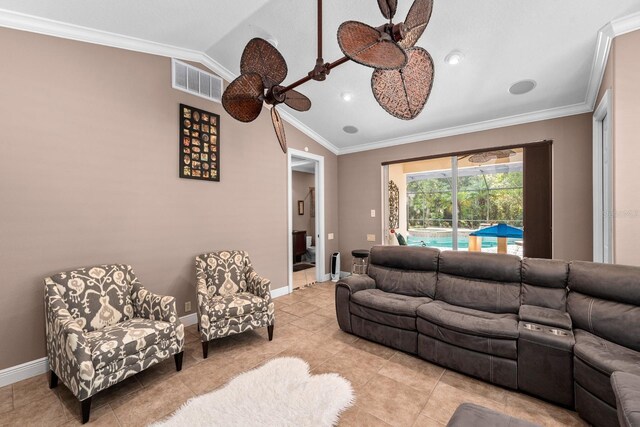 living area featuring baseboards, visible vents, vaulted ceiling, and crown molding