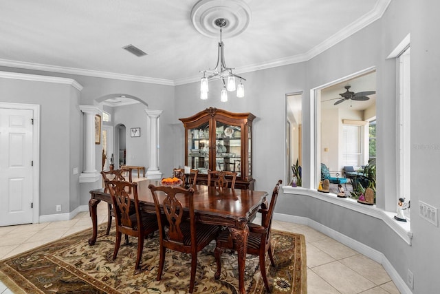 dining space featuring decorative columns, visible vents, arched walkways, and light tile patterned floors