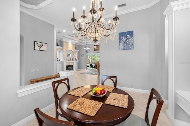 dining space with baseboards, visible vents, a chandelier, and crown molding