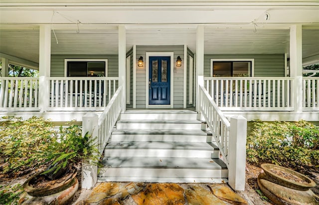 property entrance with covered porch