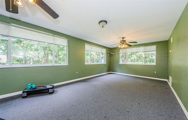 carpeted empty room with ceiling fan