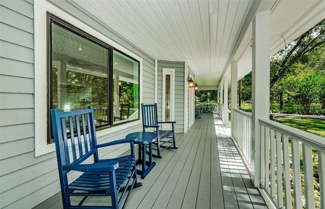 wooden terrace featuring a porch