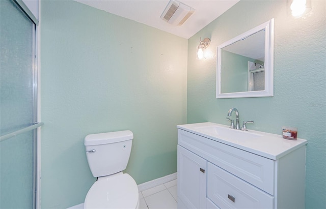 bathroom with visible vents, baseboards, toilet, vanity, and tile patterned flooring