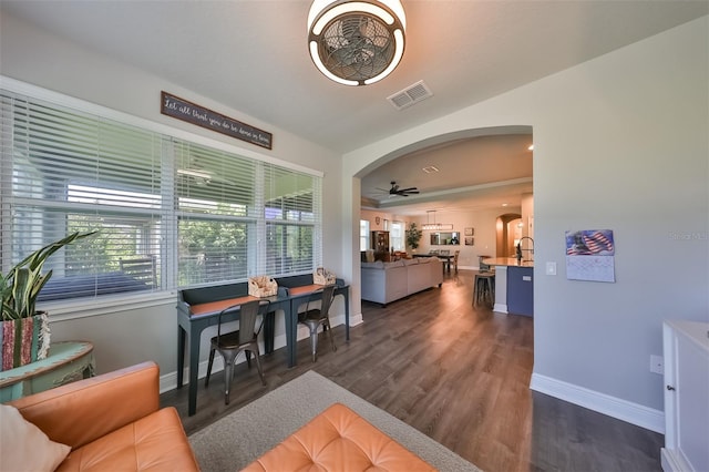 dining space featuring dark hardwood / wood-style flooring and ceiling fan