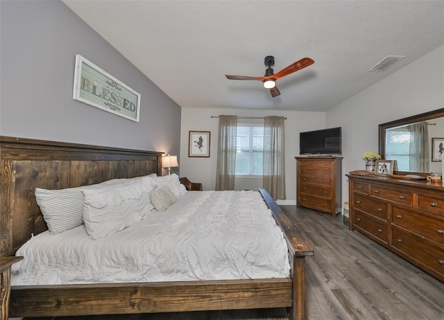 bedroom with ceiling fan and hardwood / wood-style flooring