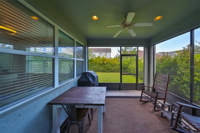 sunroom / solarium with ceiling fan