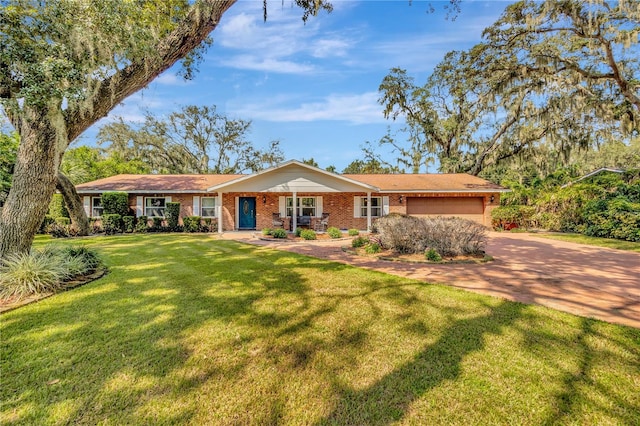 single story home featuring a front yard and a garage