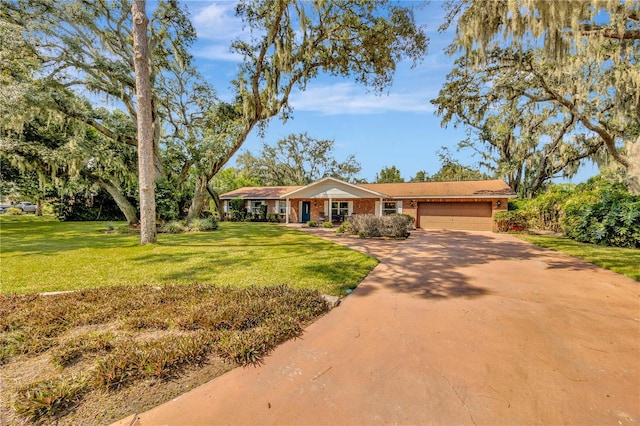 ranch-style house with a garage and a front lawn