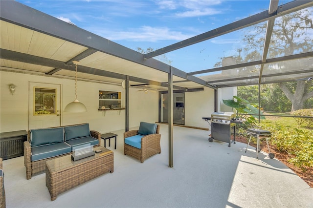 view of patio / terrace featuring an outdoor hangout area, glass enclosure, and area for grilling