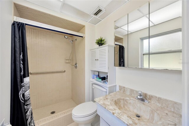 bathroom featuring vanity, toilet, and a shower with shower curtain