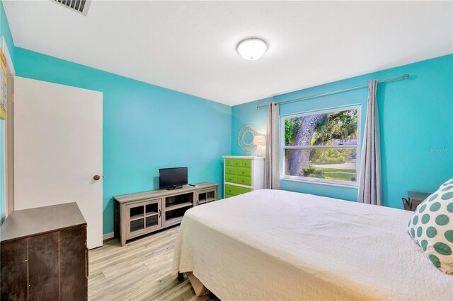 bedroom with light hardwood / wood-style flooring