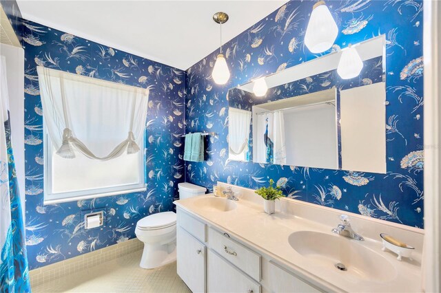 bathroom featuring tile patterned flooring, vanity, and toilet