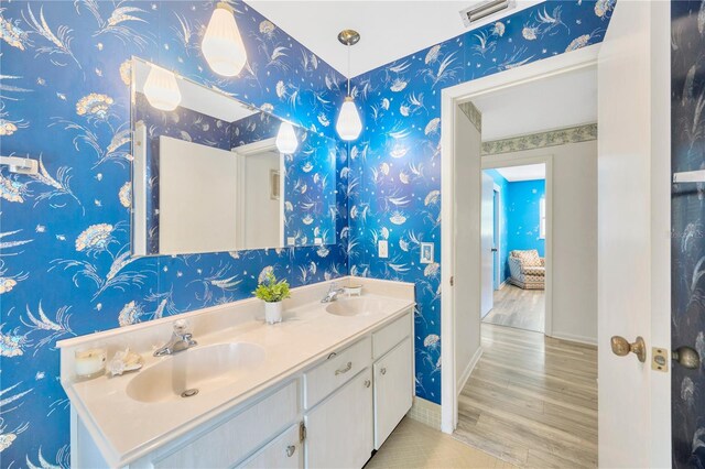 bathroom featuring hardwood / wood-style flooring and vanity