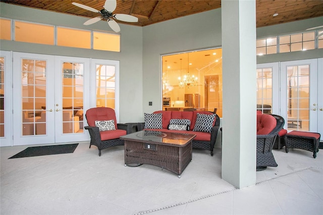 view of patio / terrace with french doors, an outdoor living space, and a ceiling fan