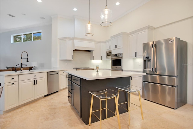 kitchen with a sink, stainless steel appliances, white cabinets, and light countertops