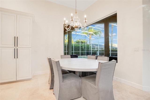 dining room featuring a sunroom, a notable chandelier, and baseboards