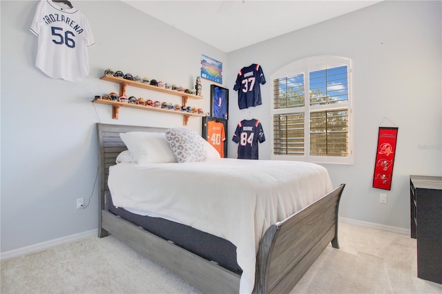 bedroom with carpet flooring and baseboards