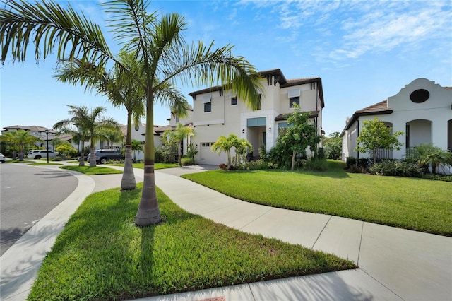 mediterranean / spanish home featuring a front yard