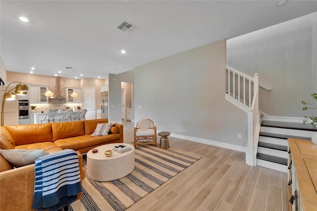 living room with light hardwood / wood-style flooring