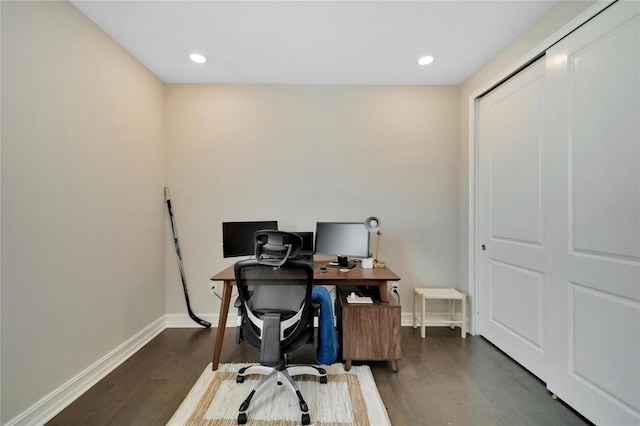 office with dark hardwood / wood-style flooring