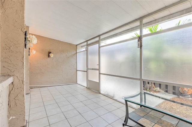 unfurnished sunroom with a wealth of natural light