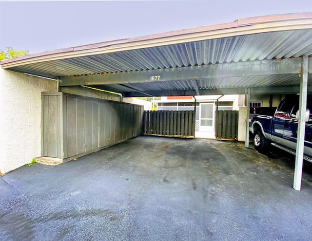 garage featuring a carport