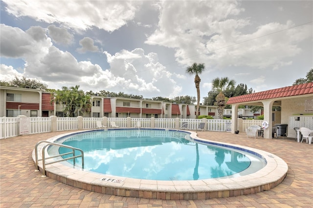 view of swimming pool with a patio area