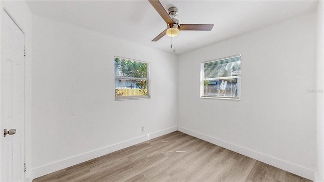 unfurnished room with ceiling fan, light hardwood / wood-style floors, and a healthy amount of sunlight