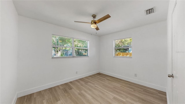 unfurnished room featuring light wood-type flooring and ceiling fan