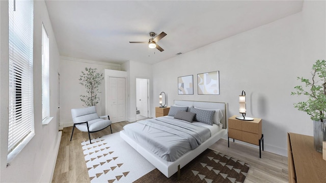 bedroom with light hardwood / wood-style flooring, a closet, and ceiling fan