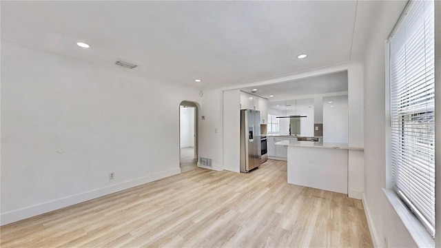 unfurnished living room featuring light wood-type flooring