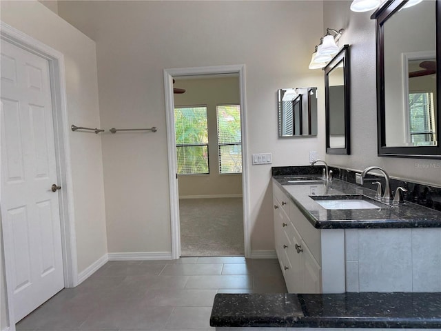 bathroom featuring tile patterned flooring and vanity