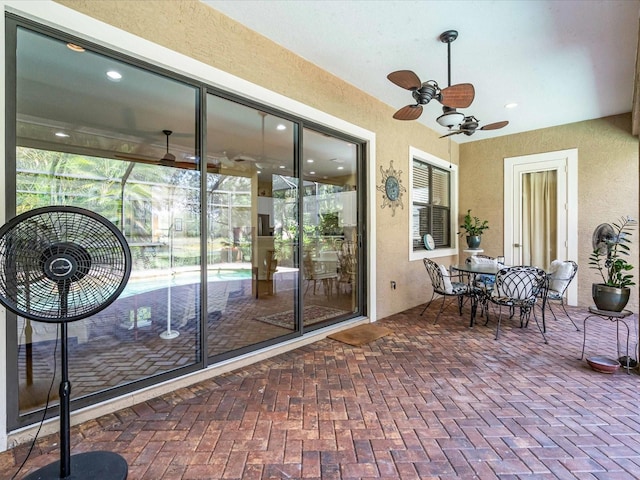 exterior space featuring ceiling fan