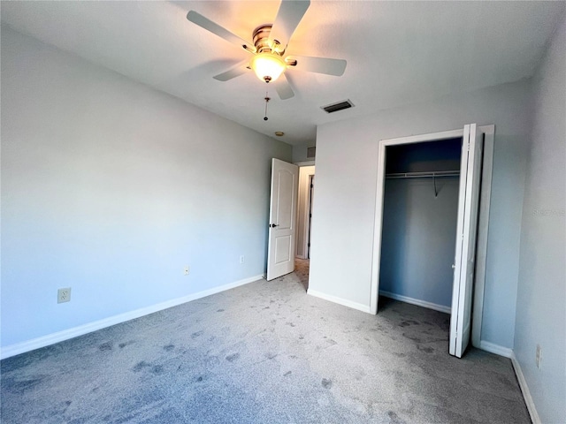 unfurnished bedroom featuring carpet floors, ceiling fan, and a closet