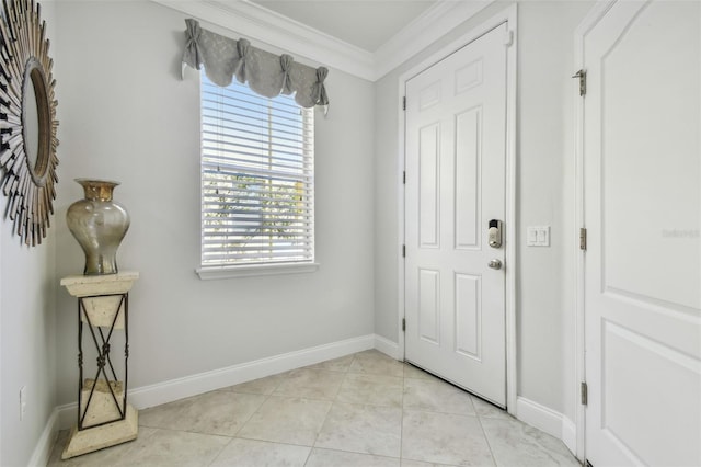 tiled entryway featuring ornamental molding