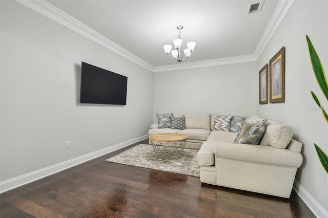 living room with crown molding, dark hardwood / wood-style floors, and a chandelier