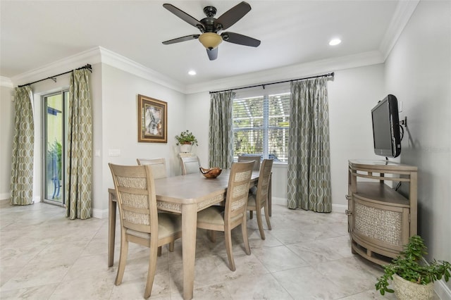 dining area with ceiling fan and crown molding