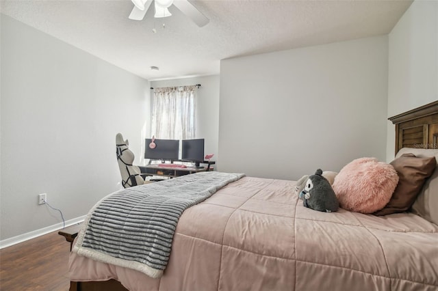 bedroom featuring ceiling fan, a textured ceiling, and hardwood / wood-style floors