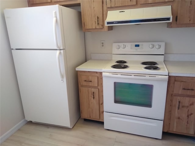 kitchen with light wood-type flooring, white appliances, and range hood