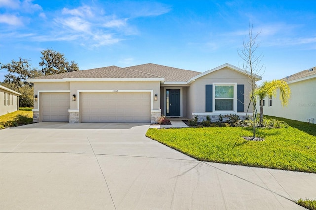 view of front of house featuring a front yard and a garage