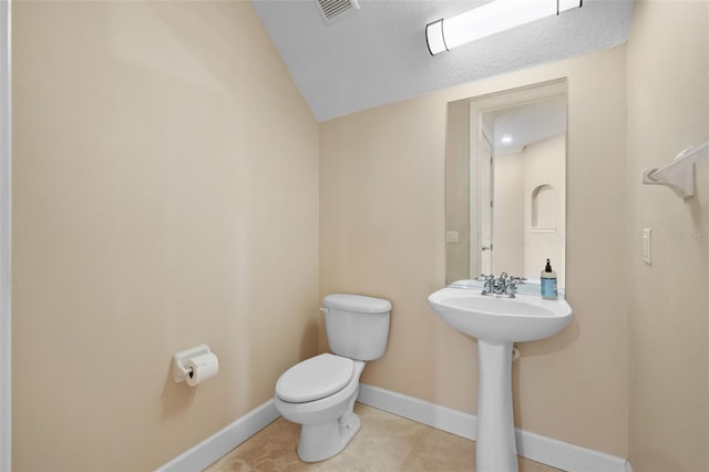 bathroom featuring tile patterned floors and toilet