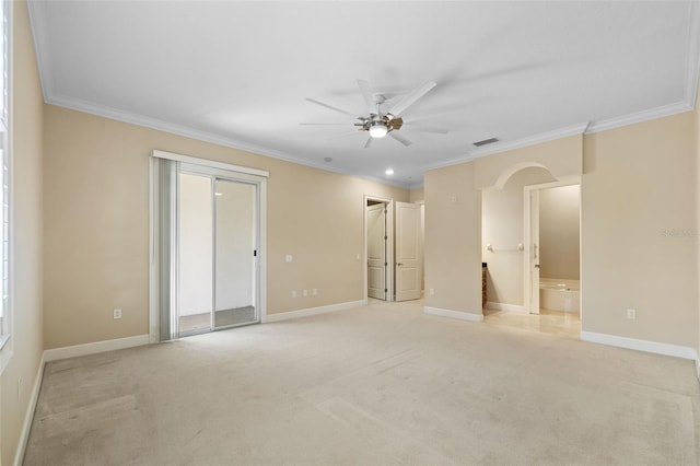 carpeted empty room featuring ceiling fan and crown molding