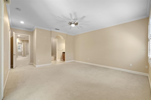 unfurnished room featuring ceiling fan, light colored carpet, and crown molding