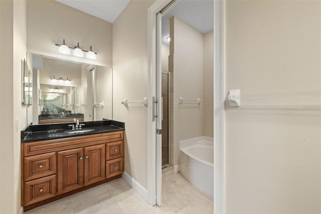 bathroom featuring tile patterned floors, vanity, and shower with separate bathtub