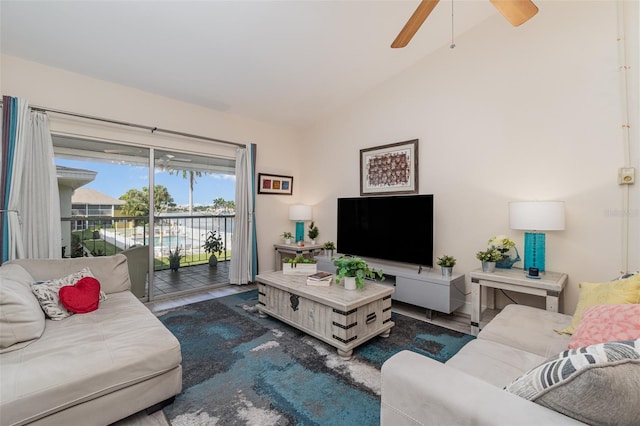 living room with ceiling fan and vaulted ceiling