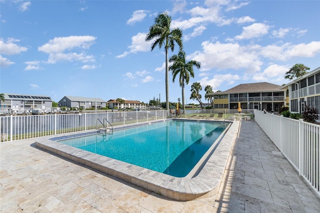 view of pool featuring a patio