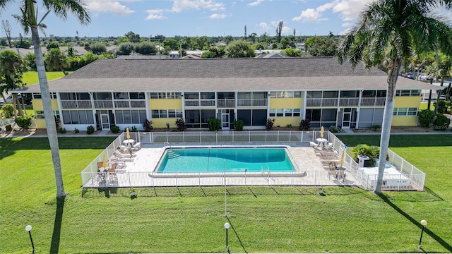 view of pool featuring a lawn and a patio