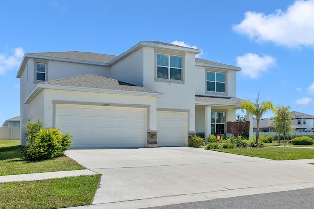 view of front property with a front lawn and a garage